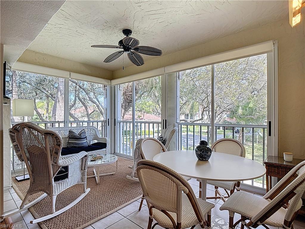 106 Siena Way, Unit 1508 Naples, FL 34119 - Photo 40 of 47 a view of a dining room with furniture window and outside view
