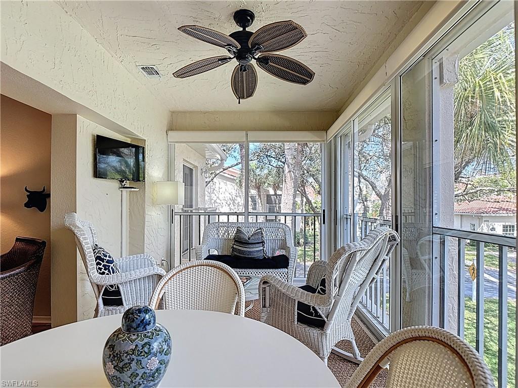 106 Siena Way, Unit 1508 Naples, FL 34119 - Photo 41 of 47 a workspace with furniture window and outside view