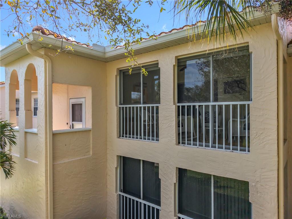 106 Siena Way, Unit 1508 Naples, FL 34119 - Photo 44 of 47 a view of a house with a yard