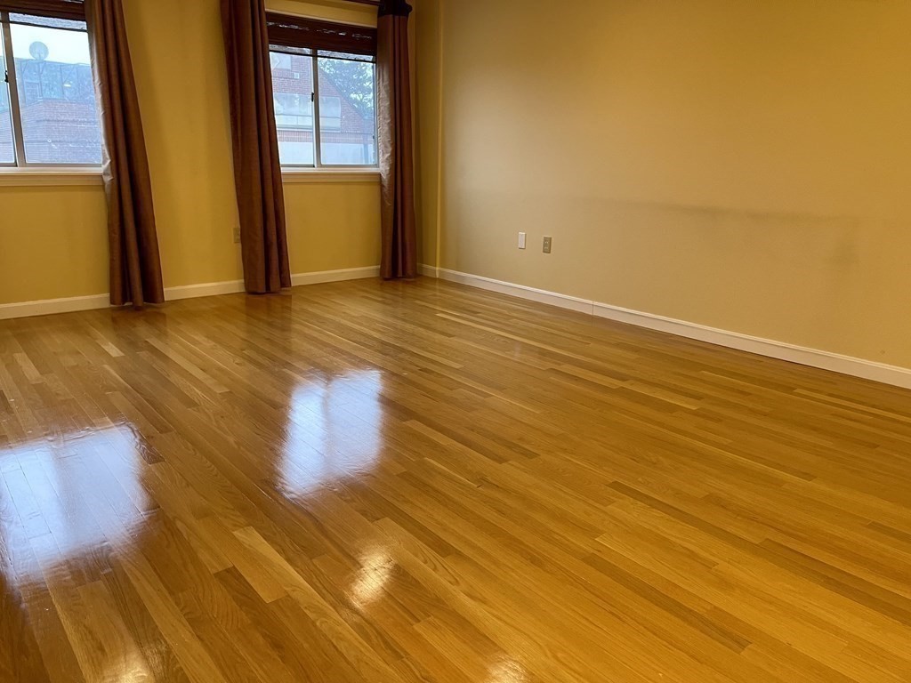 20 Webster Street, Unit 405 Brookline, MA 02446 - Photo 7 of 22 a view of an empty room with a window