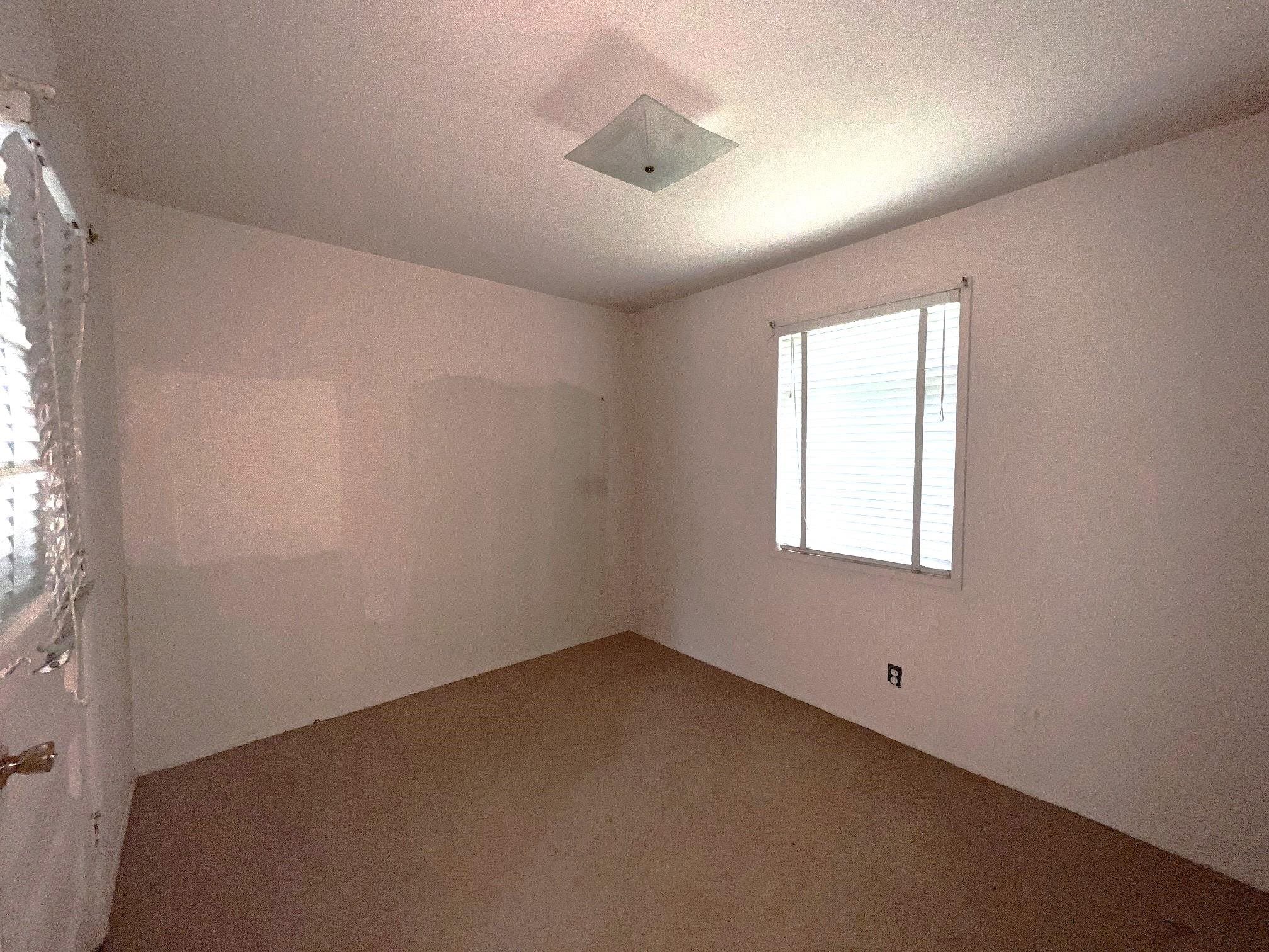 535 Fleda Road Memphis, TN 38120 - Photo 5 of 14 an empty room with a window