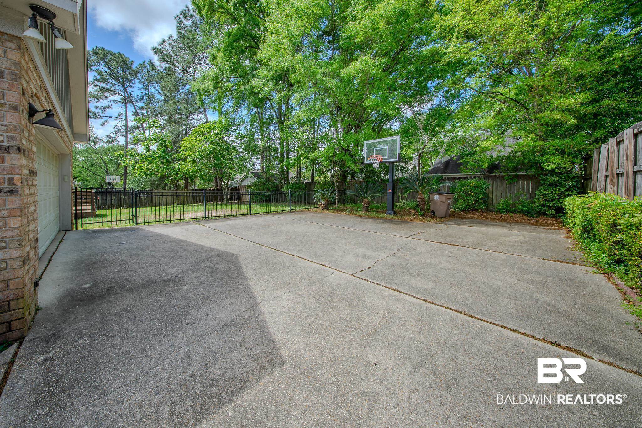 1250 Savannah Drive Mobile, AL 36609 - Photo 5 of 35 Fenced backyard with a patio area
