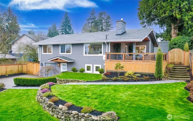 a front view of a house with a yard table and chairs