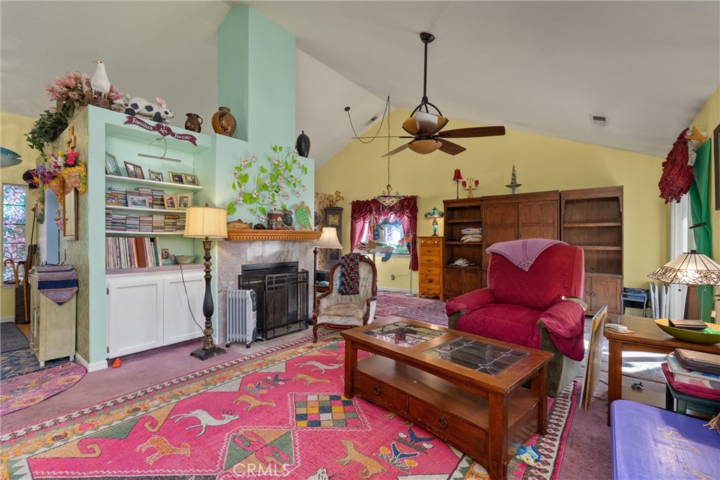 23 Carriage Lane Chico, CA 95926 - Photo 11 of 41 a living room with lots of furniture and a chandelier