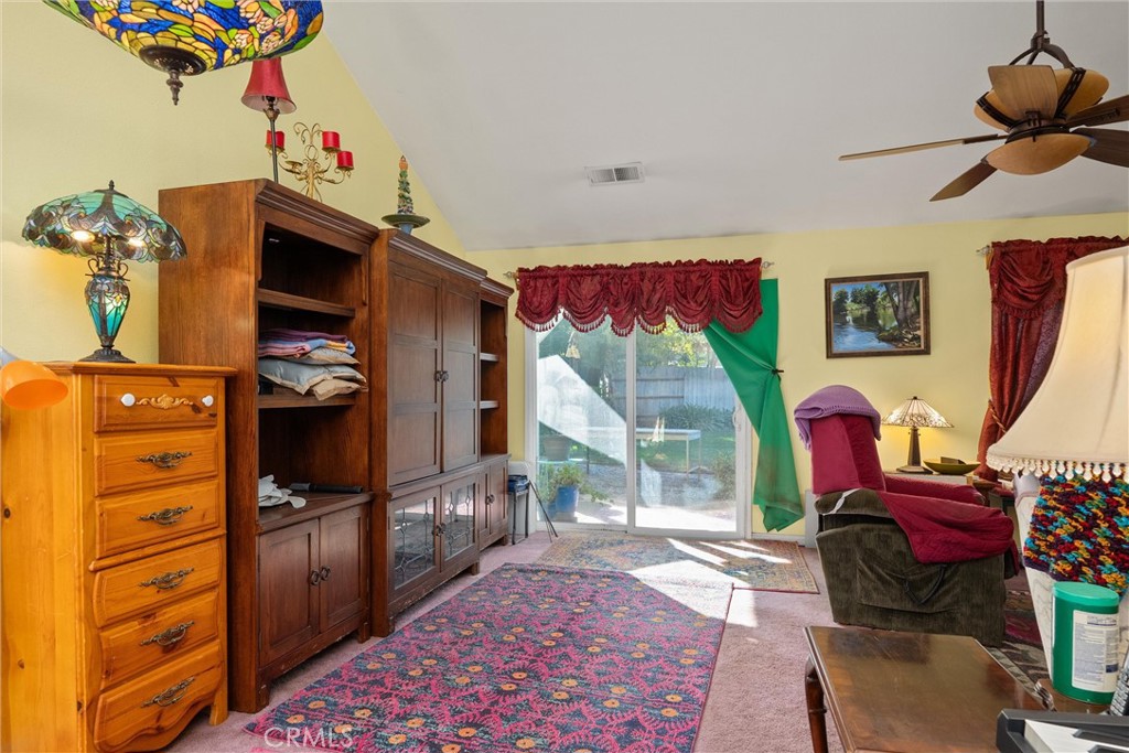 23 Carriage Lane Chico, CA 95926 - Photo 14 of 41 a living room with furniture a flat screen tv and a refrigerator