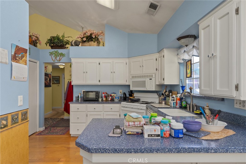 23 Carriage Lane Chico, CA 95926 - Photo 23 of 41 a kitchen with a refrigerator and sink