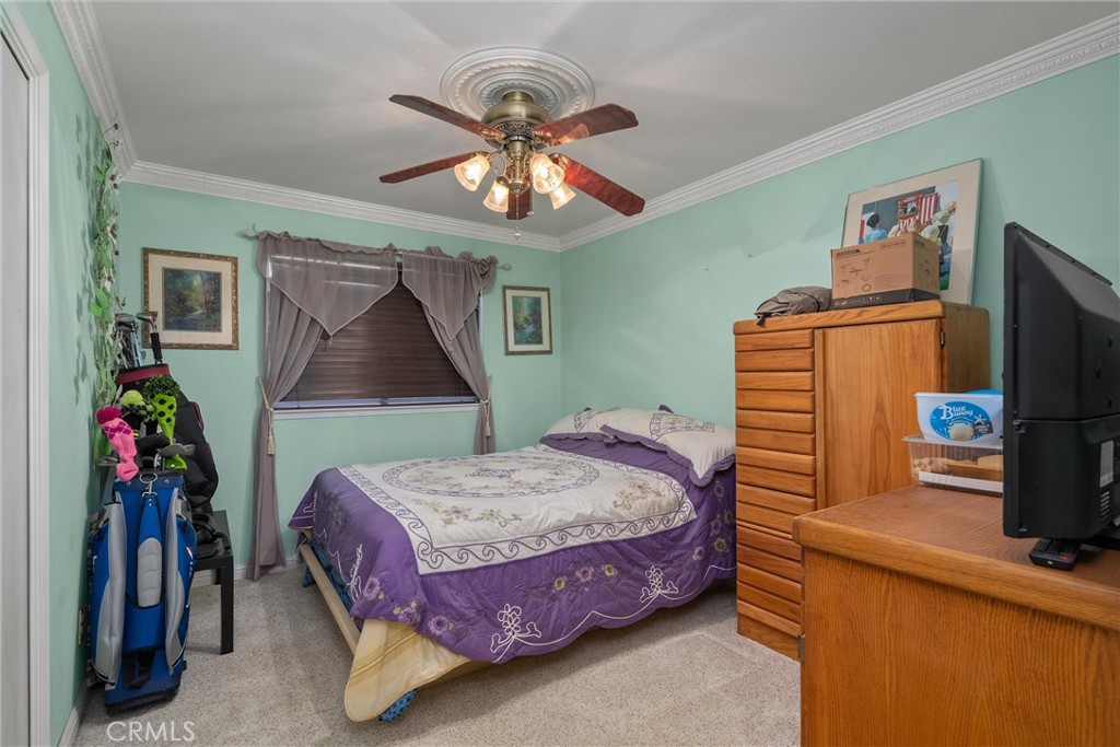 23 Carriage Lane Chico, CA 95926 - Photo 26 of 41 a bedroom with a bed and a flat screen tv