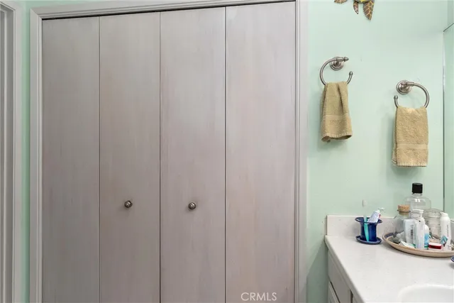 a bathroom with a sink and mirror