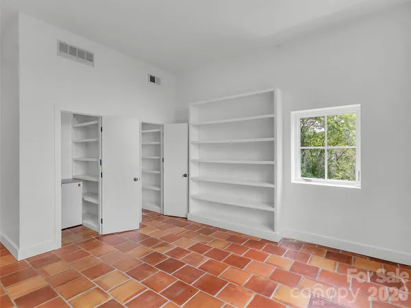 a view of room with stairs and a closet