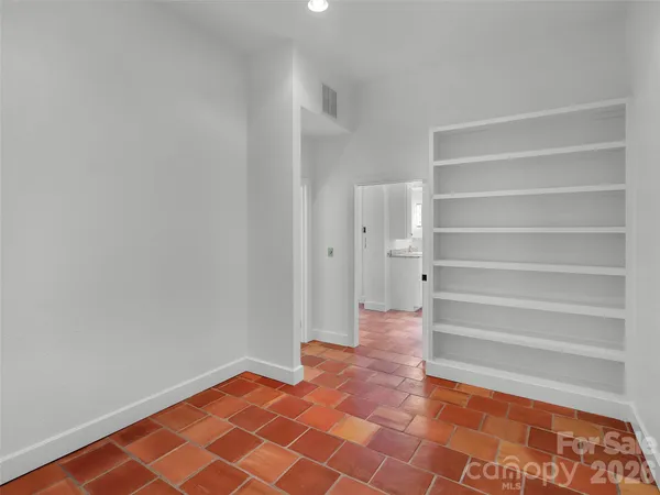 a bath tub sitting in a bathroom next to a window