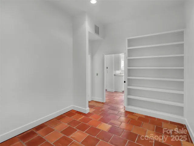 a bath tub sitting in a bathroom next to a window