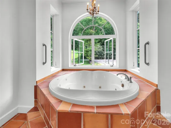 a bedroom with a bed and a fireplace