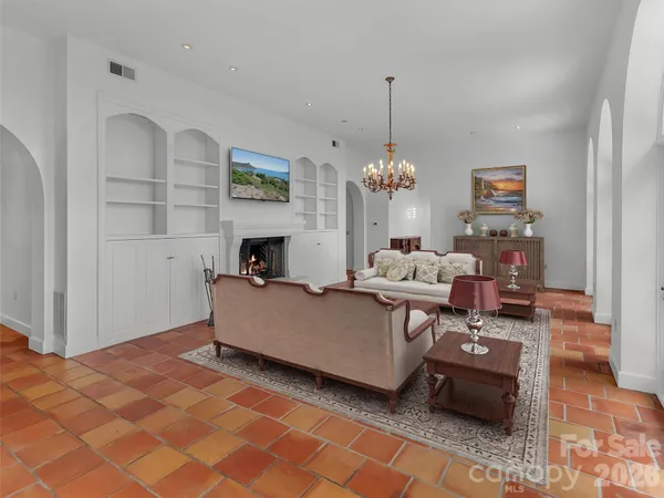 a kitchen with granite countertop a sink a counter top space and stainless steel appliances