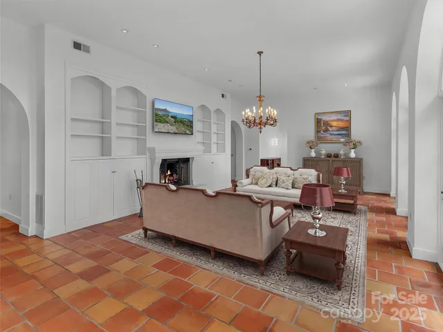a kitchen with granite countertop a sink a counter top space and stainless steel appliances