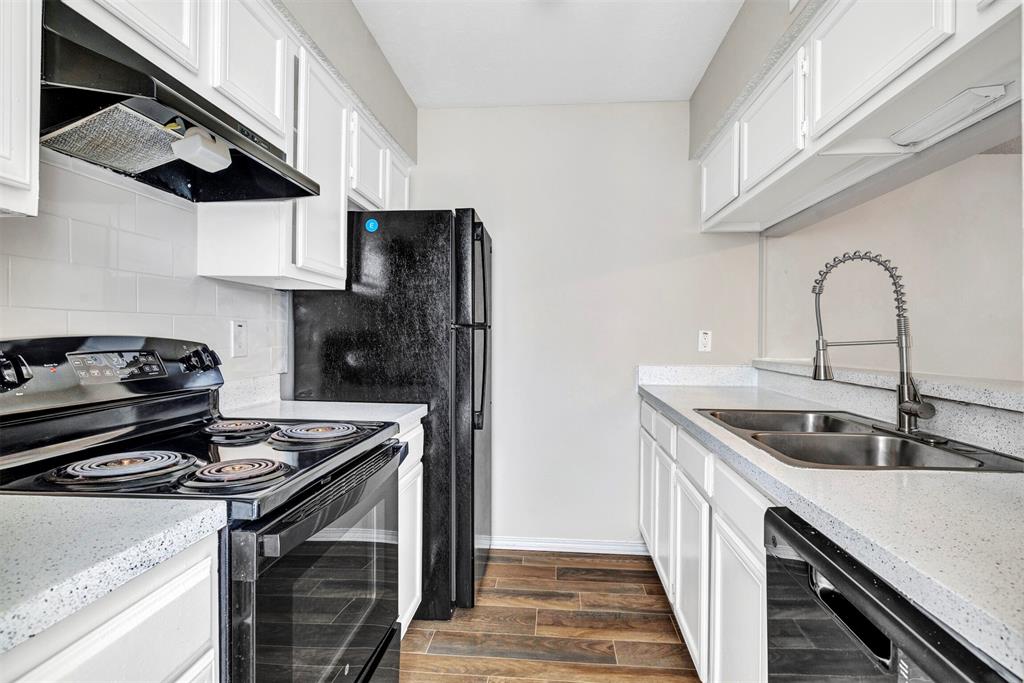 Galley kitchen with glack appliances
