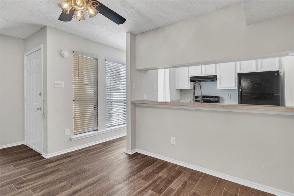 11311 Audelia Road, Unit 216 Dallas, TX 75243 - Photo 3 of 15 Dining area with view of entry and pass through/bar to kitchen