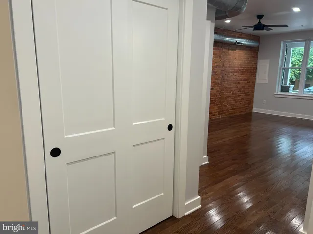 a view of bathroom with wooden floor