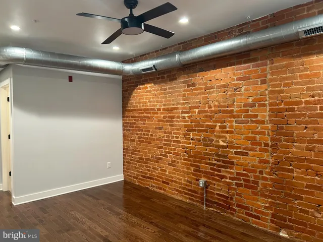 a view of a livingroom with wooden floor