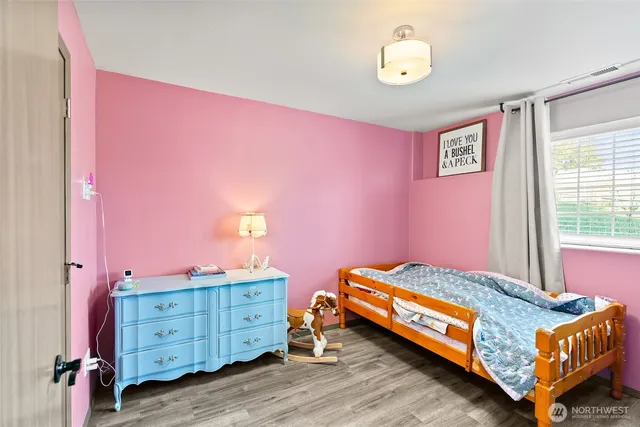 a bed room with a bed and a window