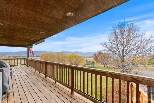 a view of balcony with wooden floor