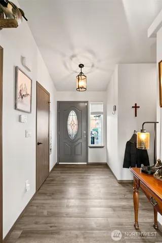 a view of a workspace with wooden floor