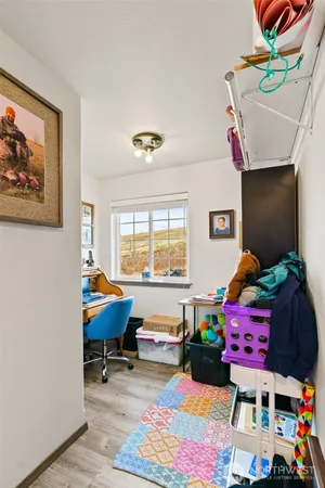 a playing room with toys and a large window