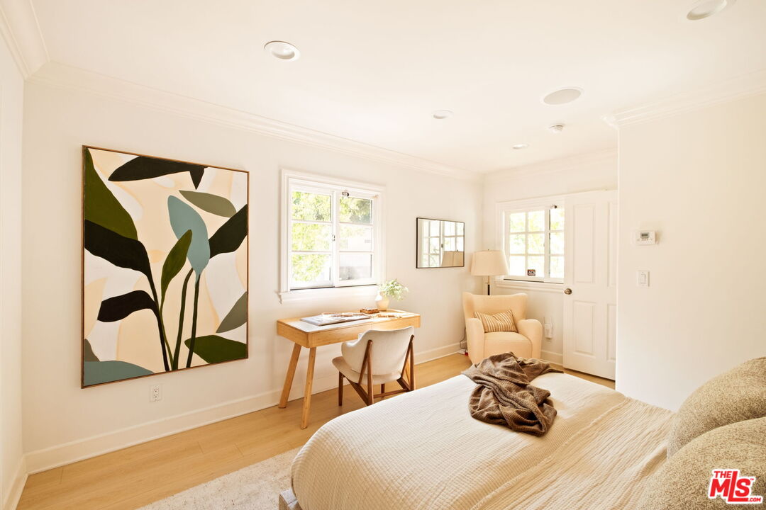 1132 Chantilly Road Los Angeles, CA 90077 - Photo 12 of 22 a bedroom with a bed and wooden floor