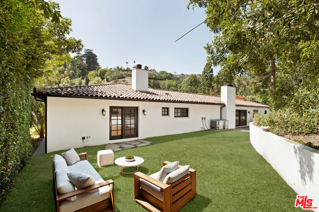 1132 Chantilly Road Los Angeles, CA 90077 - Photo 21 of 22 a view of a house with back yard