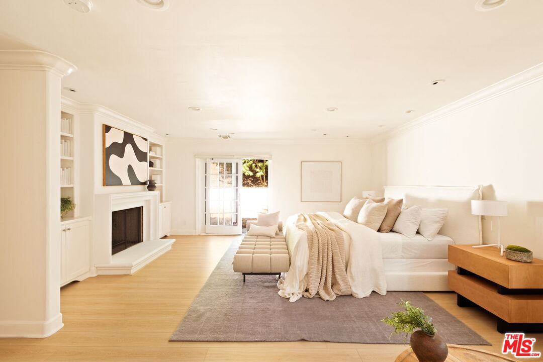 1132 Chantilly Road Los Angeles, CA 90077 - Photo 10 of 22 a living room with furniture and a fireplace