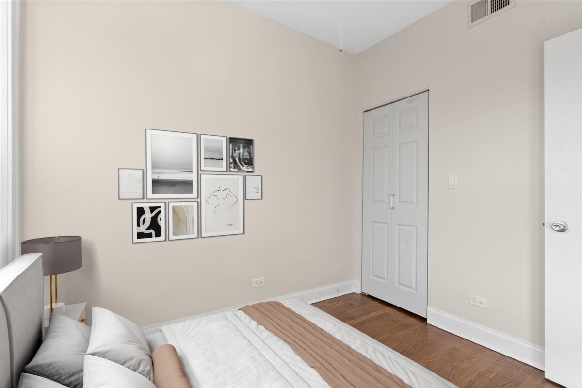 4420 North Ashland Avenue, Unit 3E Chicago, IL 60640 - Photo 10 of 15 a bedroom with a bed and cabinets