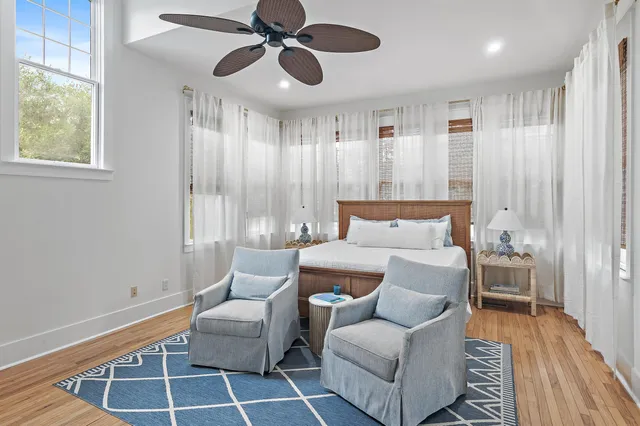 a bedroom with a large bed and a couch