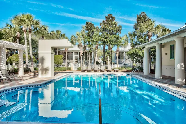 a view of swimming pool with outdoor seating and deck