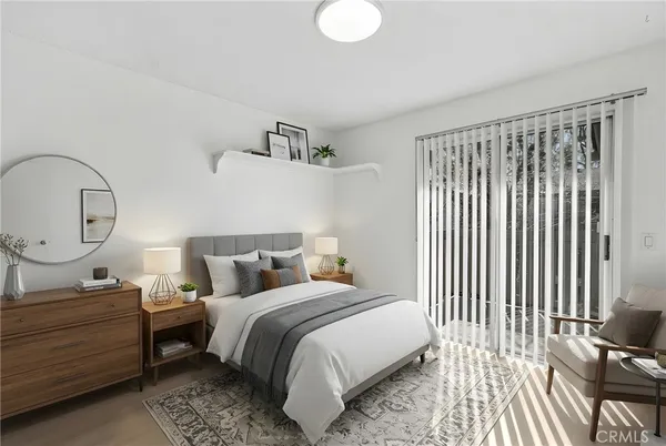 a bedroom with bed and a window