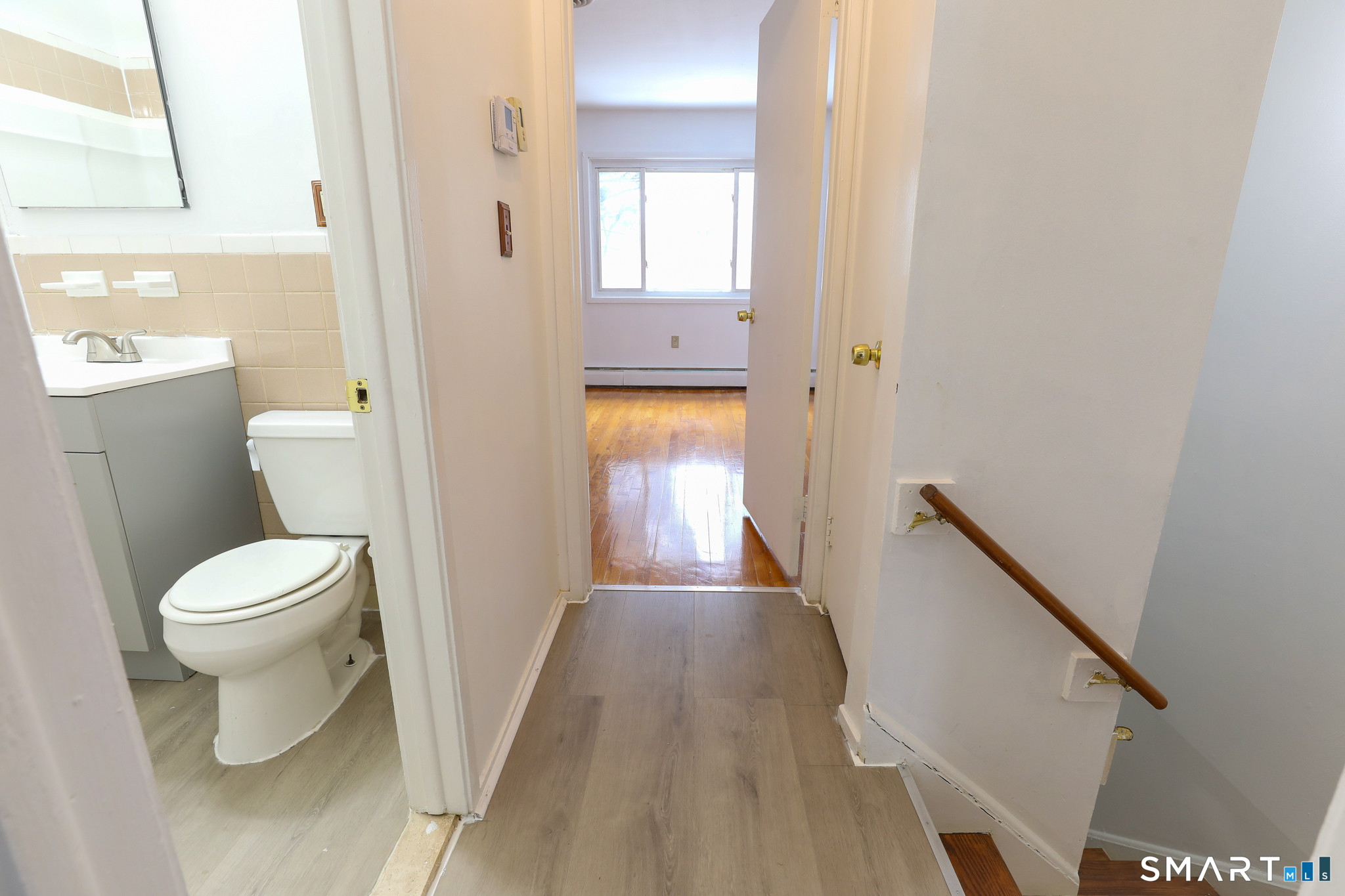 1 Camelot Drive, Unit 2 Bloomfield, CT 06002 - Photo 11 of 24 a bathroom with a toilet and a hardwood floor