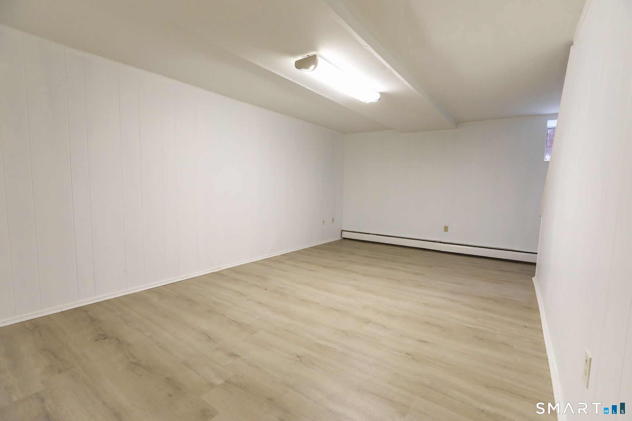 1 Camelot Drive, Unit 2 Bloomfield, CT 06002 - Photo 20 of 24 an empty room with a workbench