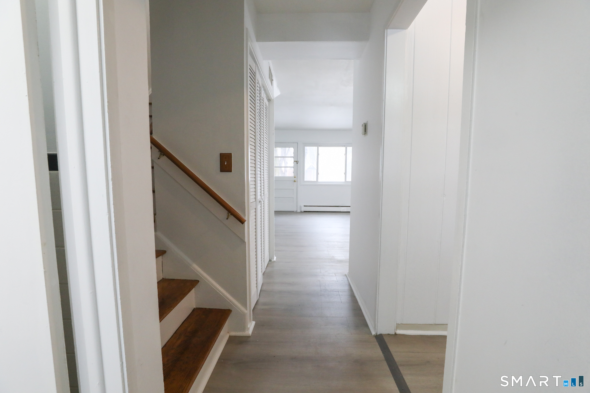 1 Camelot Drive, Unit 2 Bloomfield, CT 06002 - Photo 6 of 24 a view of entryway and hall with wooden floor