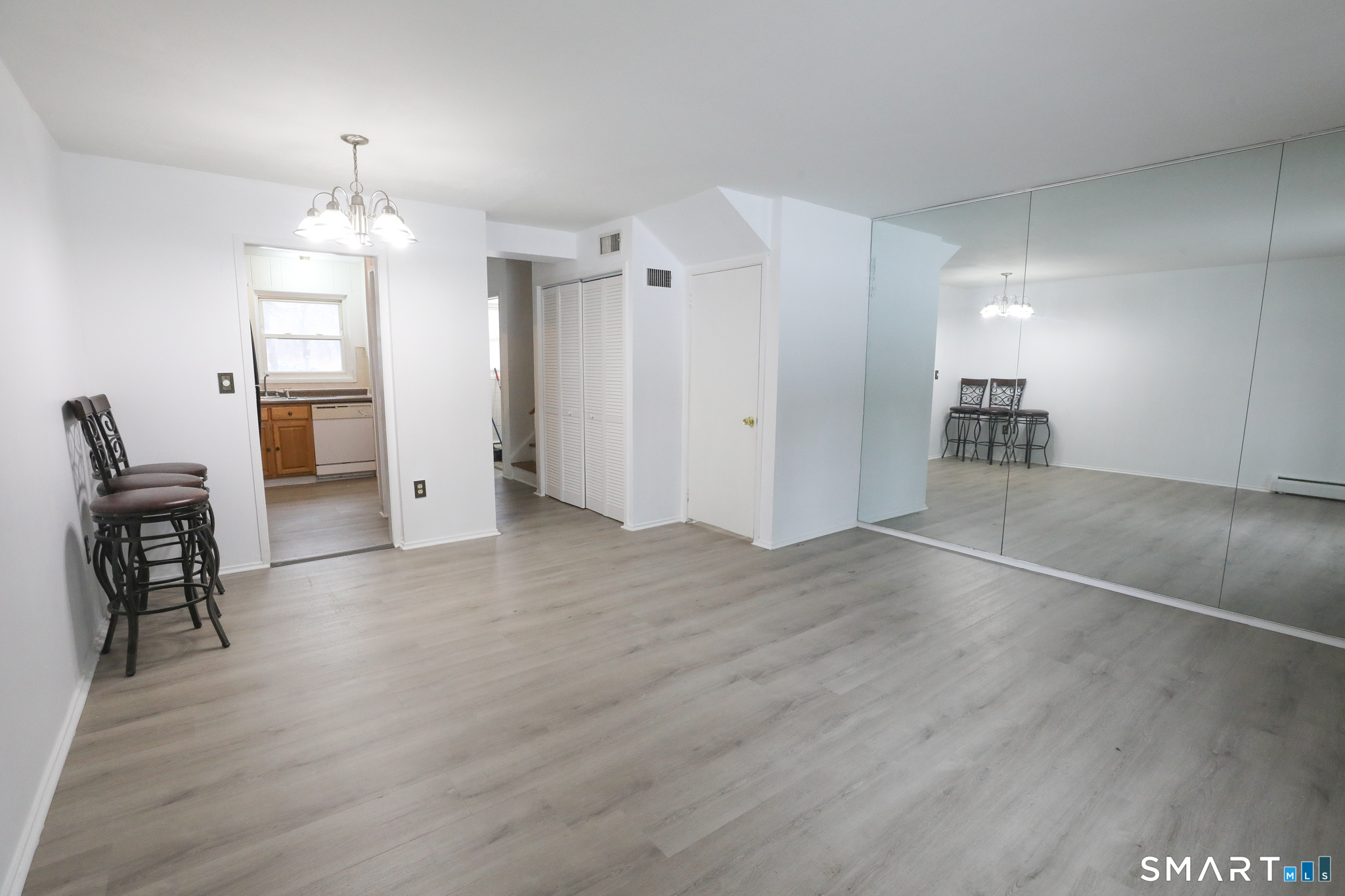 1 Camelot Drive, Unit 2 Bloomfield, CT 06002 - Photo 7 of 24 a view of livingroom with furniture and wooden floor