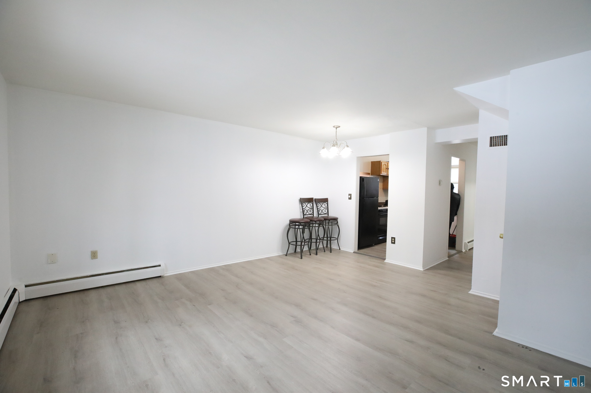 1 Camelot Drive, Unit 2 Bloomfield, CT 06002 - Photo 8 of 24 a view of a room with wooden floor