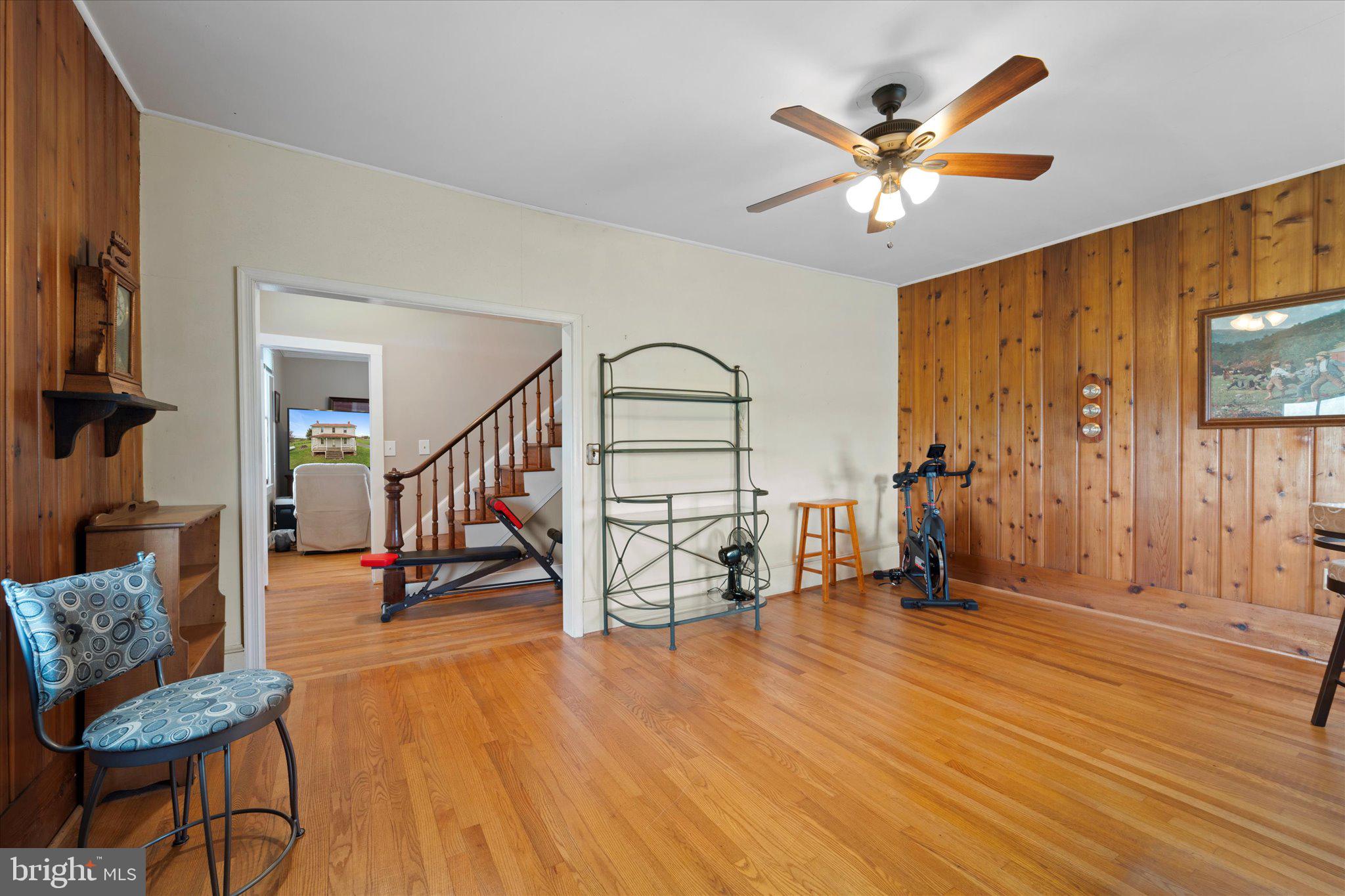 42880 Spinks Ferry Road Leesburg, VA 20176 - Photo 17 of 43 a living room with furniture and a flat screen tv