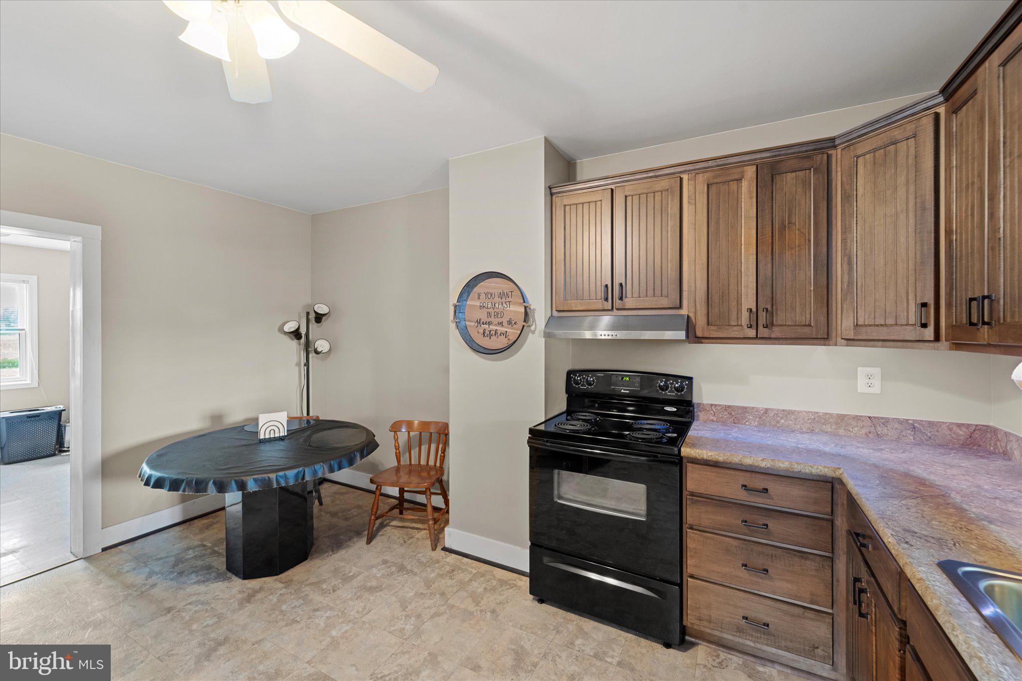 42880 Spinks Ferry Road Leesburg, VA 20176 - Photo 19 of 43 a kitchen with appliances a stove and cabinets