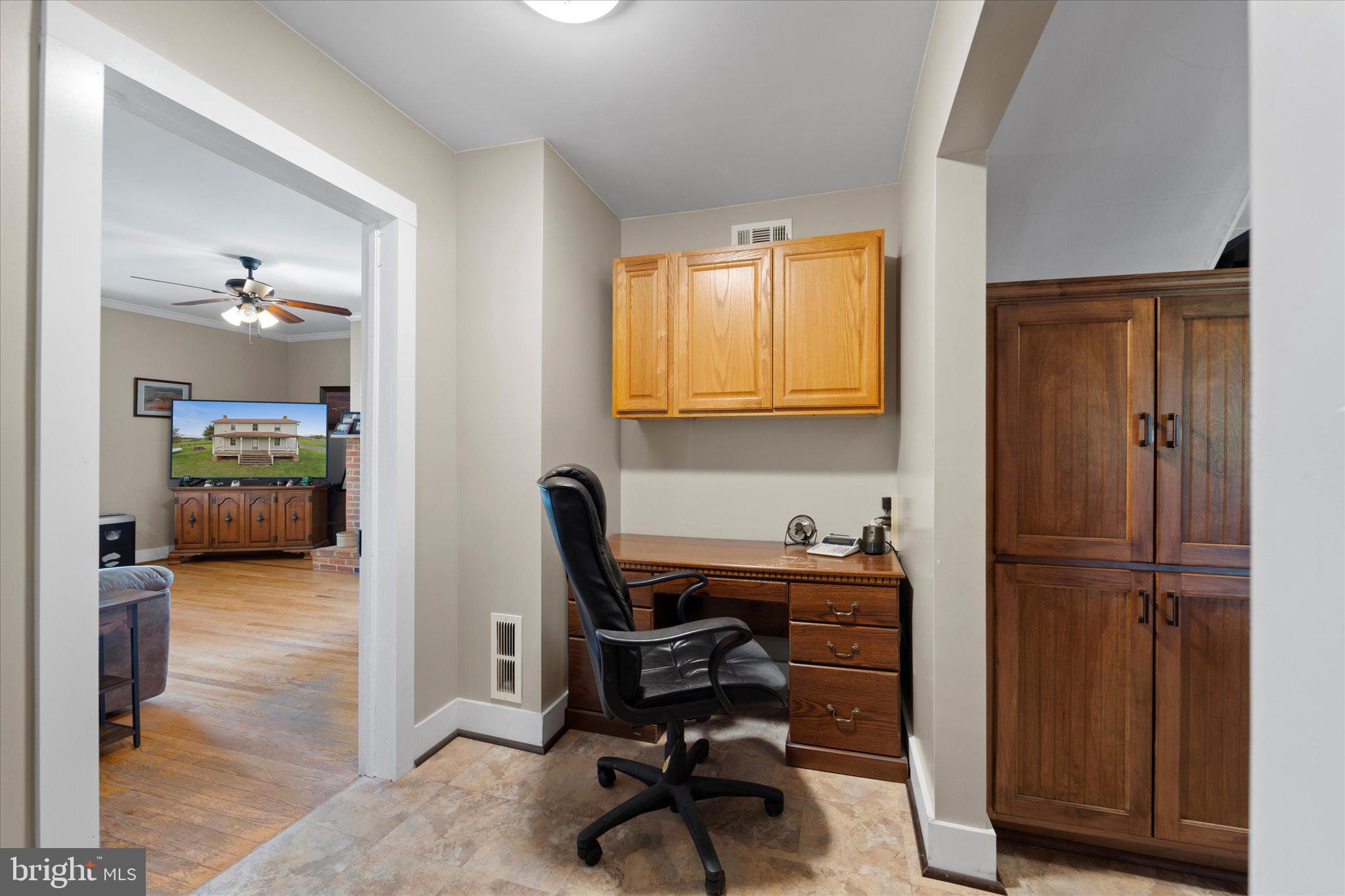 42880 Spinks Ferry Road Leesburg, VA 20176 - Photo 23 of 43 a view of a workspace with furniture and a window