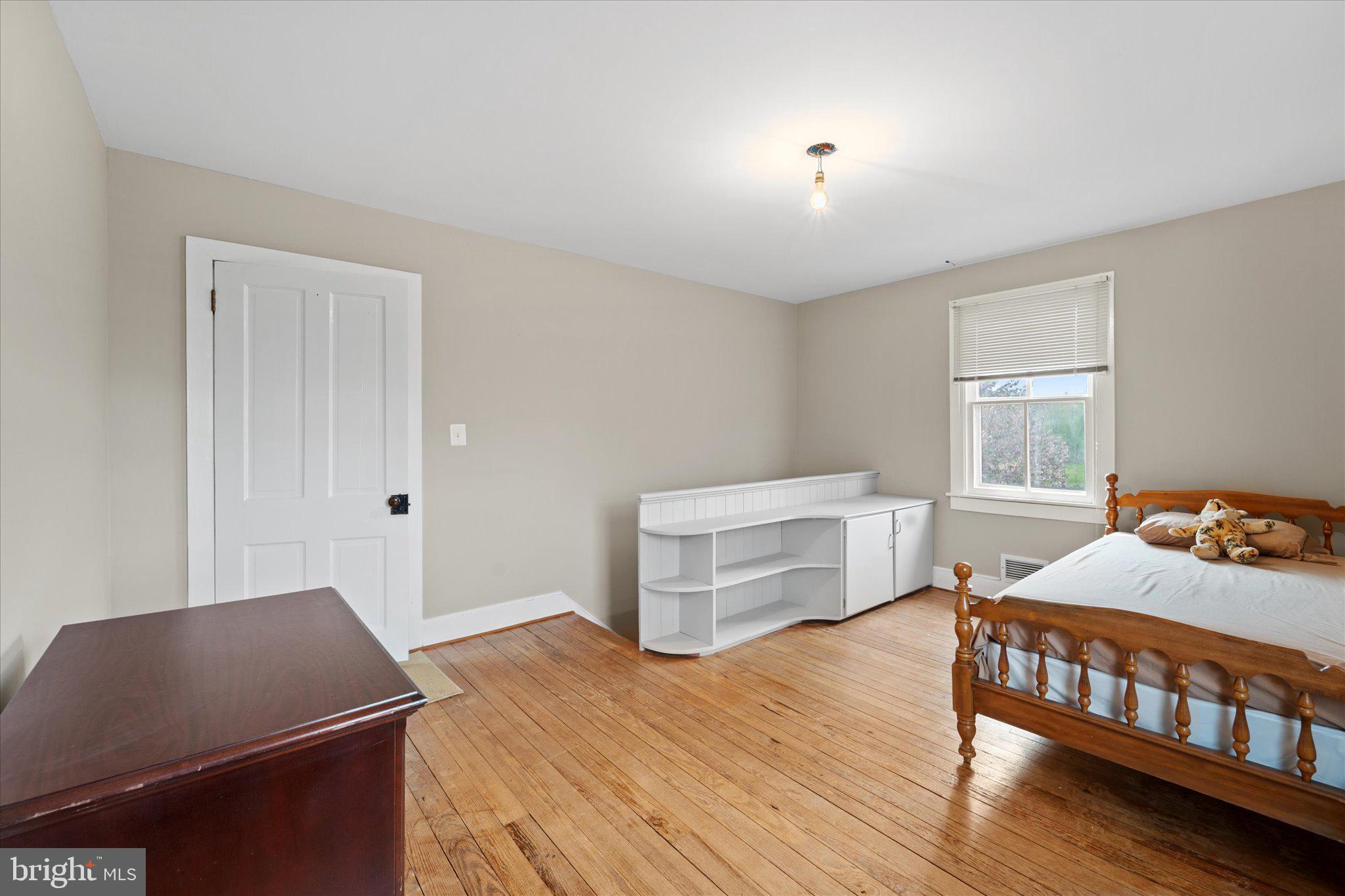 42880 Spinks Ferry Road Leesburg, VA 20176 - Photo 36 of 43 a bedroom with furniture and a window
