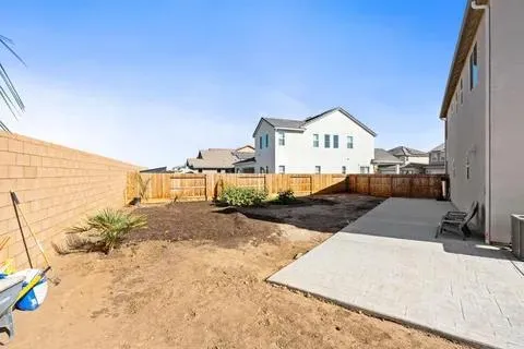 a view of a house with a snow in the background