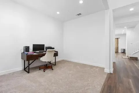 a view of a workspace with furniture