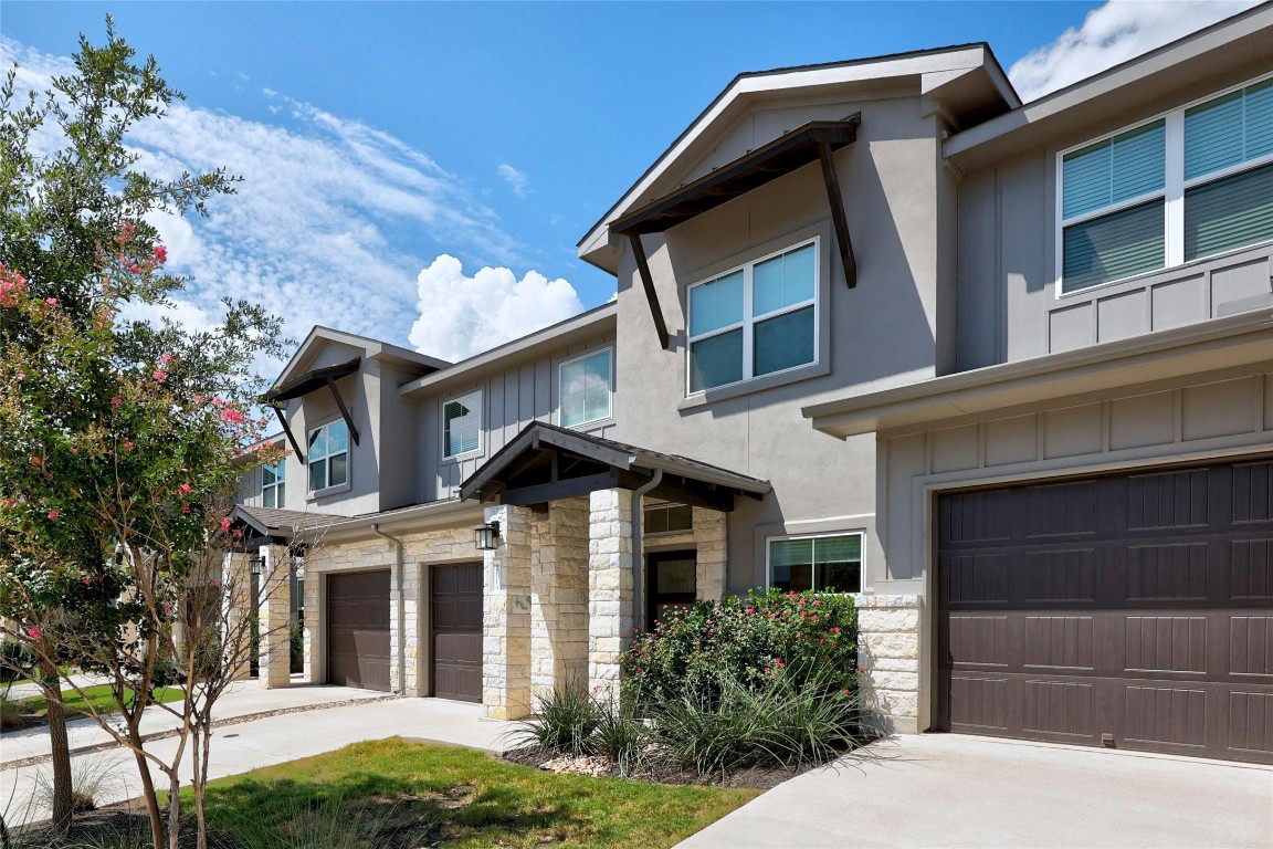2113 Local Rebel Loop Leander, TX 78641 - Photo 1 of 30 a front view of a house with garden