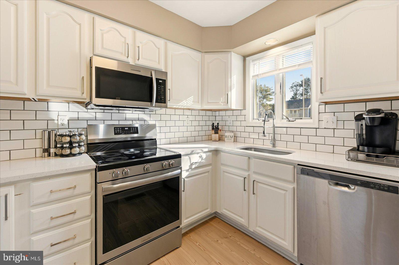 730 Canvasback Court Salisbury, MD 21804 - Photo 13 of 43 a kitchen with cabinets stainless steel appliances and a sink