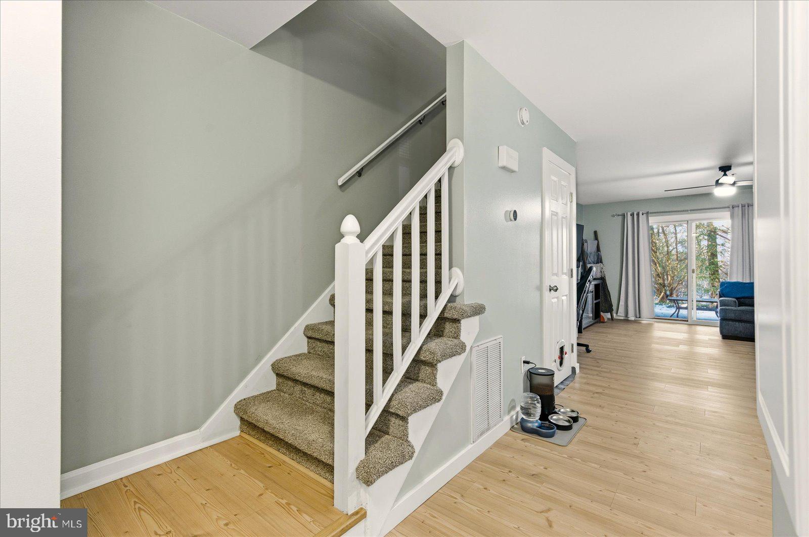 730 Canvasback Court Salisbury, MD 21804 - Photo 19 of 43 a view of a hallway with wooden floor and staircase