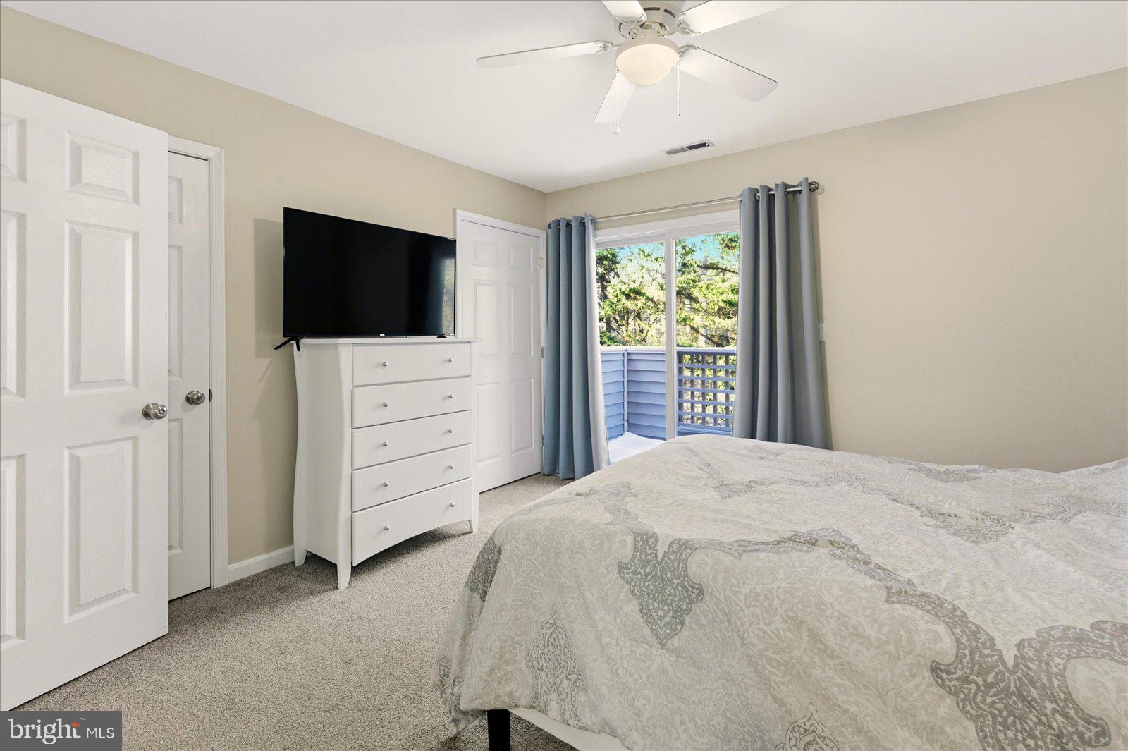 730 Canvasback Court Salisbury, MD 21804 - Photo 21 of 43 a bedroom with a bed and a flat screen tv