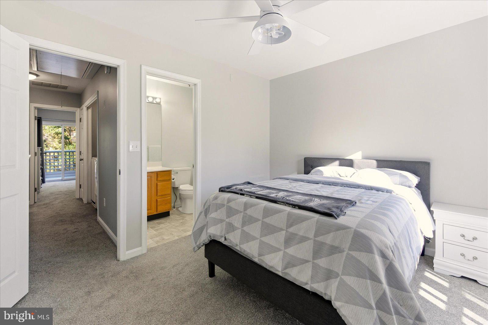 730 Canvasback Court Salisbury, MD 21804 - Photo 26 of 43 a bedroom with a bed and a chandelier