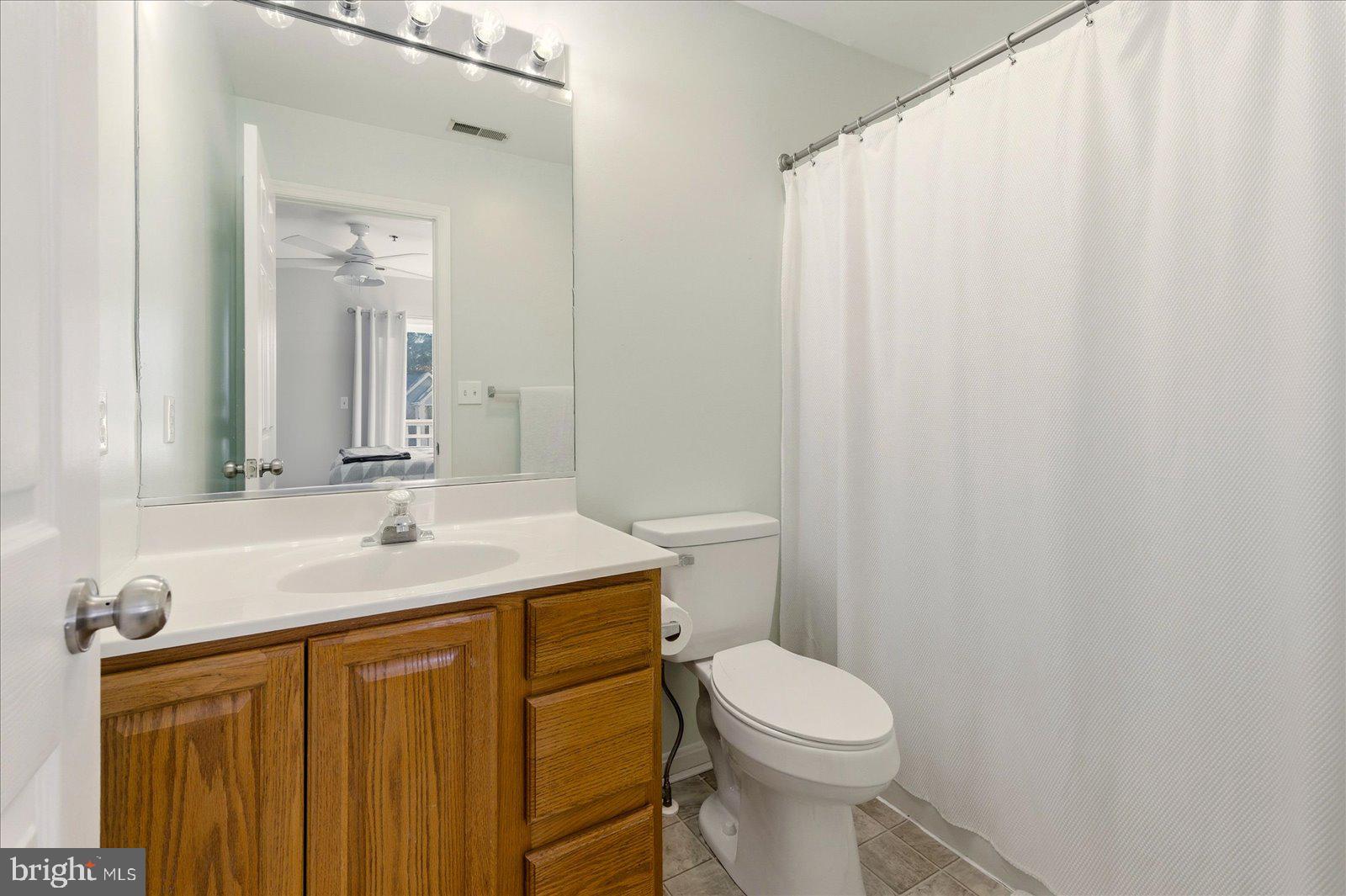 730 Canvasback Court Salisbury, MD 21804 - Photo 28 of 43 a bathroom with a sink a toilet and shower